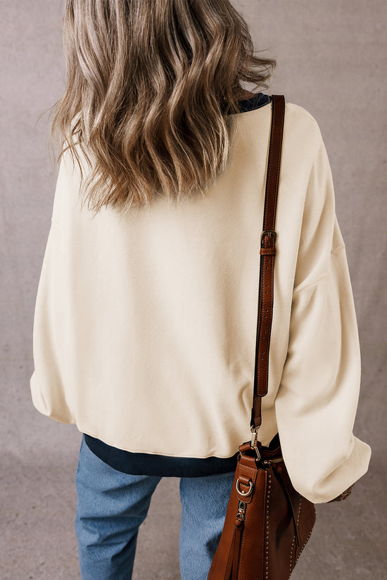 White oversized sweatshirt with dropped shoulders and color block patch