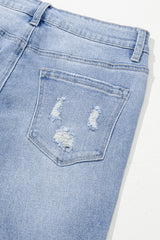 High blue flared jeans faded with acid with raw hem