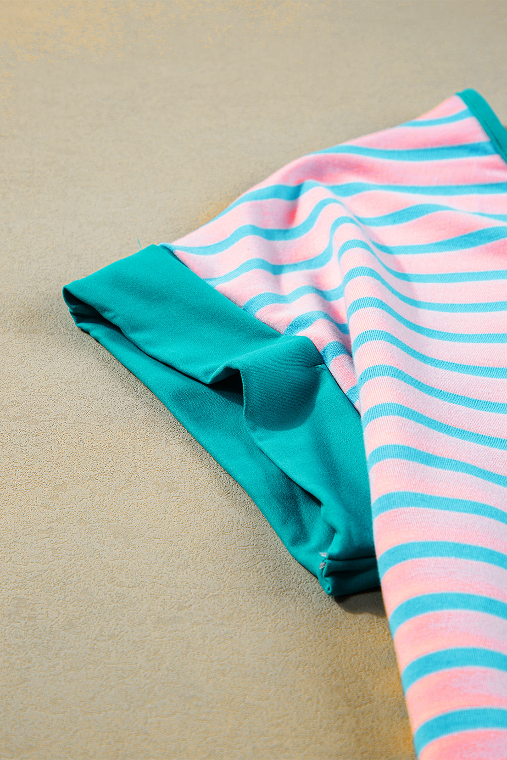 Short-sleeved and half-zip top with pink contrast stripes