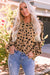 Blouse Large V -neck leopard and ruffle cuffs