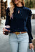 Navy blue velvet blouse with rising collar and puffy sleeves