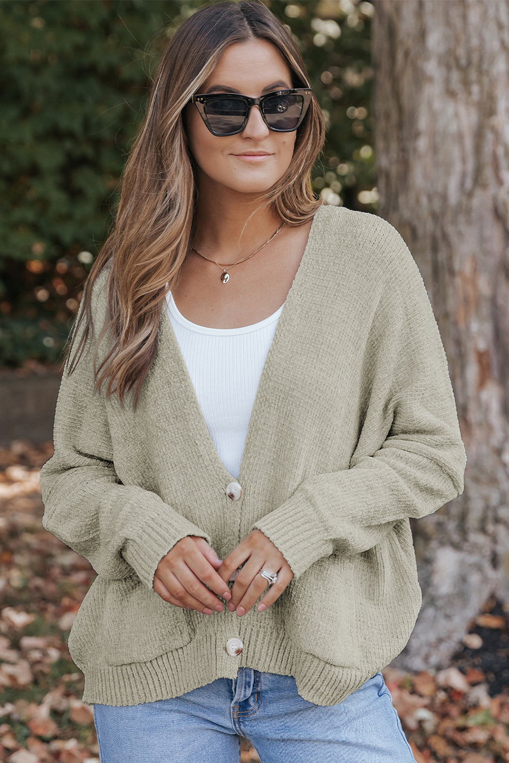 Grey sweater cardigan with front pockets and buttons