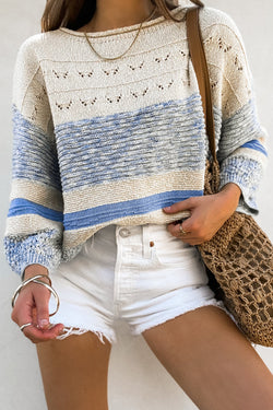 Light blue sweater with puffed sleeves and open stitch