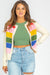 Cardigan with white striped and colored patterns, buttoned on the front