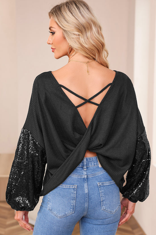 Black waffle knit top with patchwork sleeves and open back