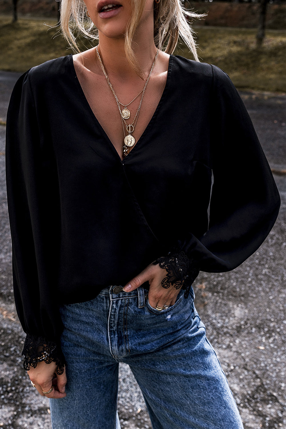 Black V -neck blouse and crochet lace cuffs