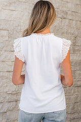 White textured blouse with embroidered ruffles *