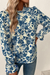 Sky blue blouse with floral print and ruffle sleeves *