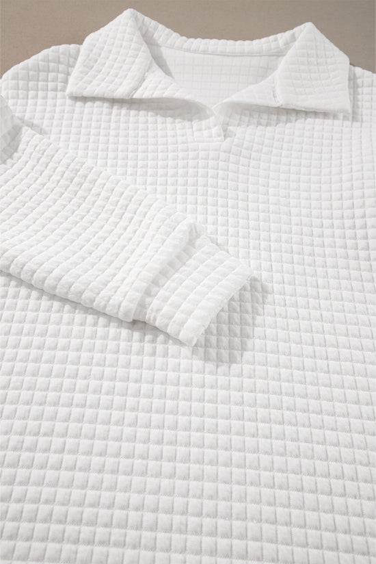 White long sleeve top with sporty collar and quilted texture