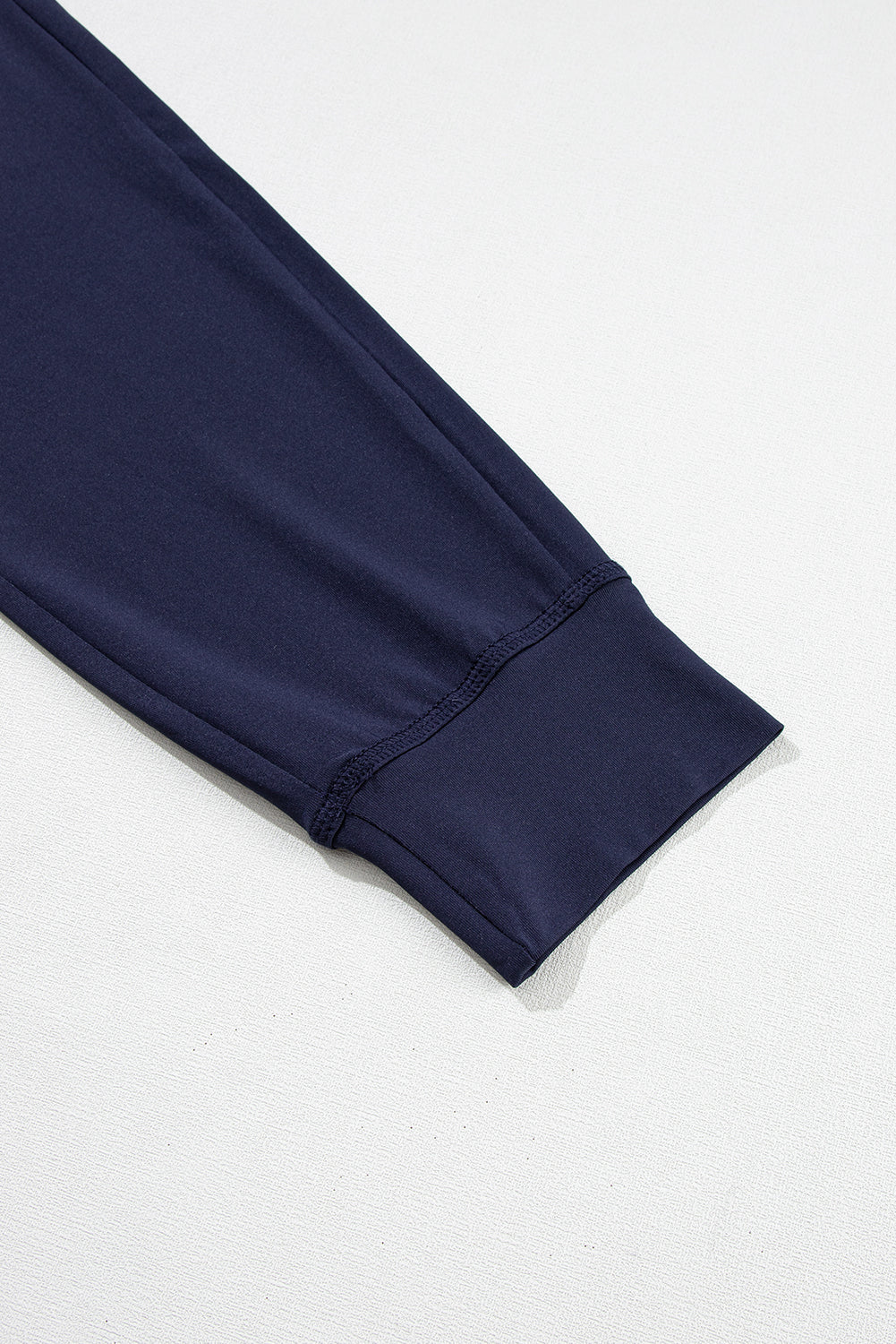 Navy blue jogging pants with pockets and drawstring waist