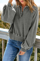 Faded gray sweatshirt with snap buttons and lantern sleeves