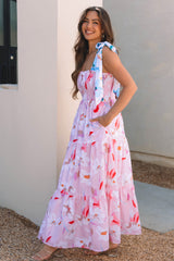 Vestido rosa largo con estampado floral y hombros anudados