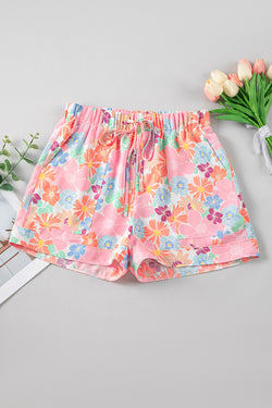 Pantalones cortos decretados con cordón de ajuste y bolsillos de estampado floral rosa lateral