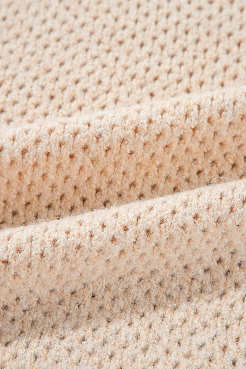 Pull ample à col en V et épaules tombantes avec œillets