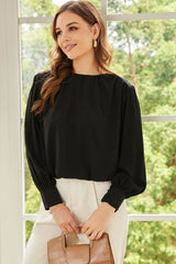 Chemisier ample plissé noir avec épaules rembourrées et poignets boutonnés-A WOMAN WE LOVE
