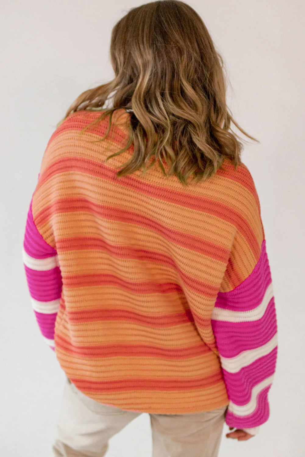 Loose sweater with orange stripes and color block, round neck, dropped shoulders