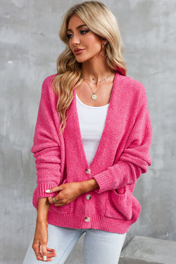 Cardigan pull avec poches sur le devant et boutons roses