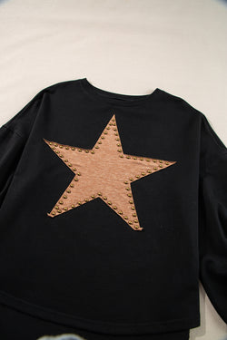 Black oversized high with long sleeves and studded star pattern