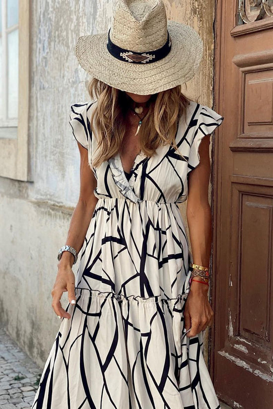 Long white dress with ruffles and V -collar with an abstract vein print