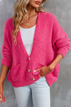 Cardigan pull avec poches sur le devant et boutons roses