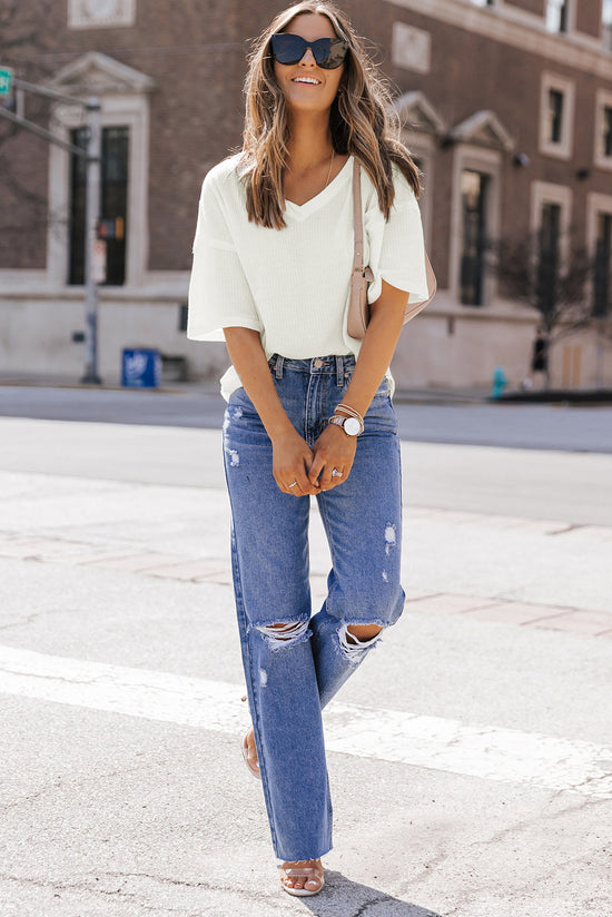 Ample white high in embossed knitting with drooping shoulders