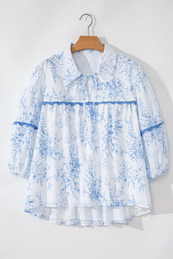 Sky blue flower blouse with 3/4 sleeves and tied collar