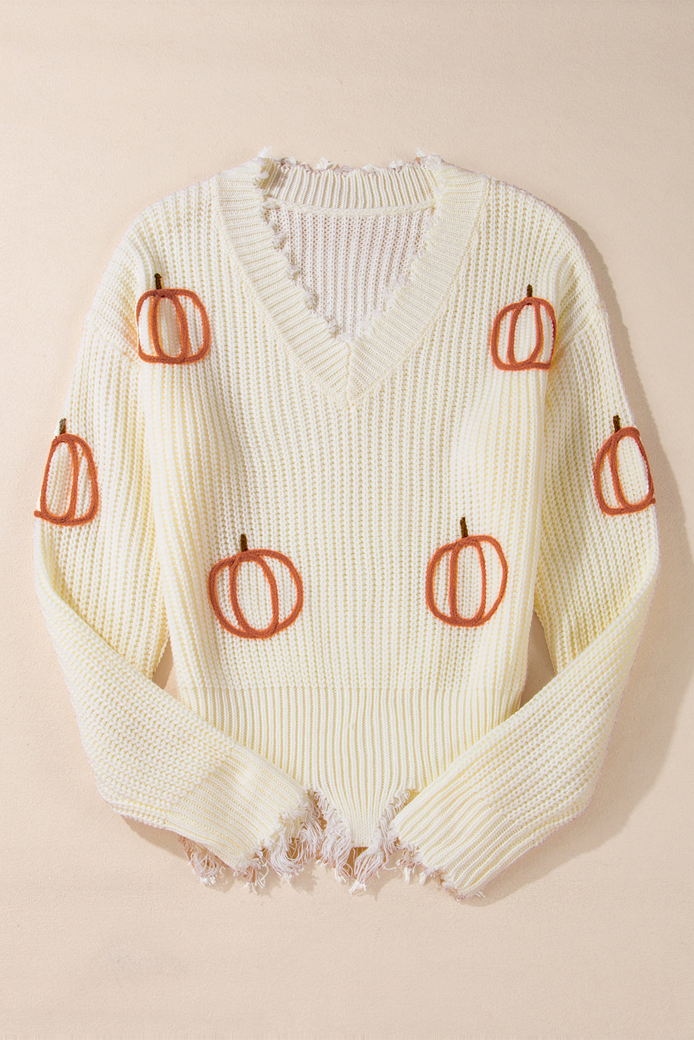 Pull ample beige en tricot torsadé avec ourlet brut et col en V