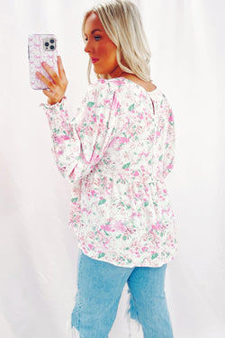 Babydoll pink blouse with floral print and frozen balloon sleeves with lock hole on the back