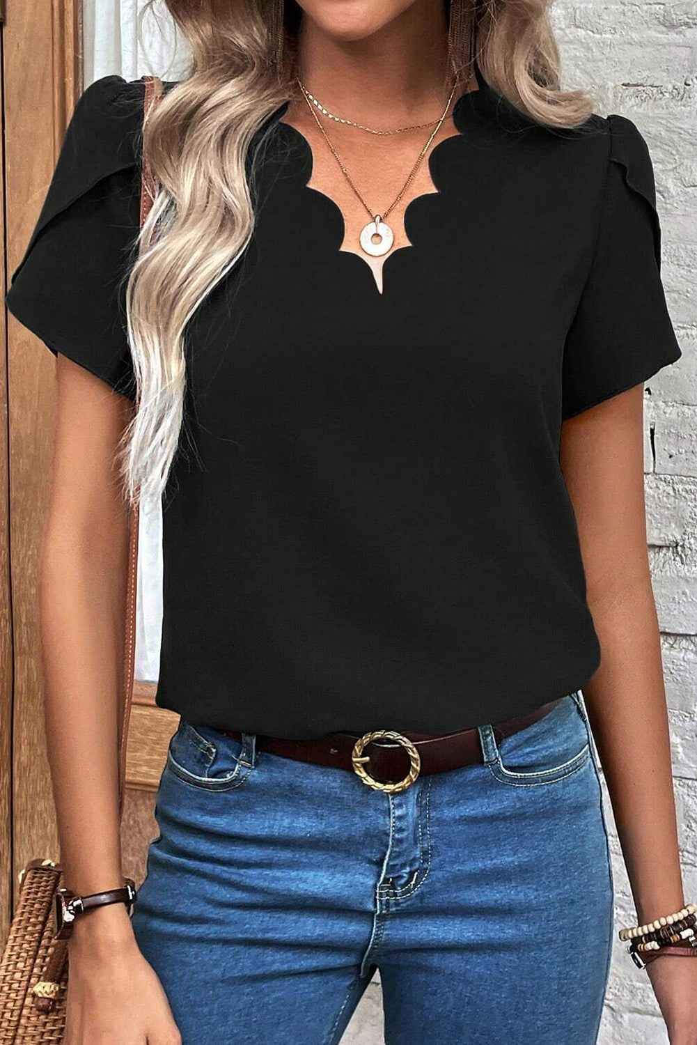Driven black top with V -neck and petal sleeves