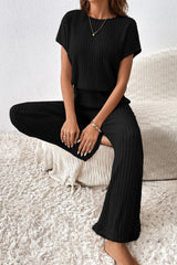 Combinaison noire côtelée à manches courtes et jambes larges de couleur unie-A WOMAN WE LOVE