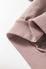 Sudadera de hombro caída y símbolo de paz floral en cabra