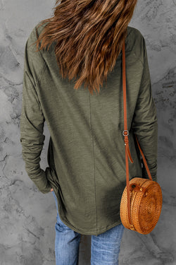 Solid green top with long sleeves and round neck