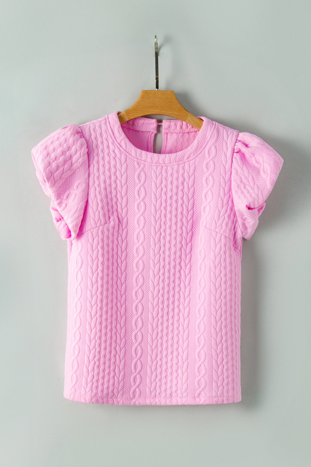 Camiseta rosa texturizada con mangas hinchadas
