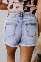 Short en jean Bleu  à poches perlées et ourlet brut