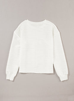 White long sleeve drop shoulder top with wavy texture