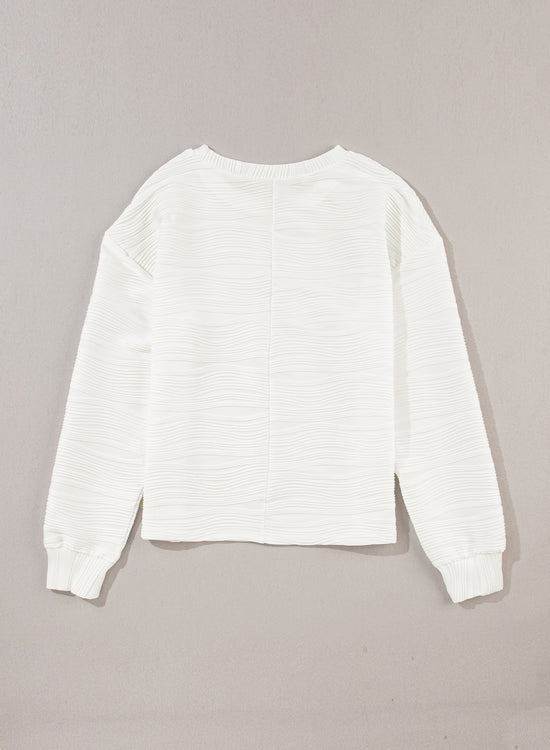 White long sleeve drop shoulder top with wavy texture