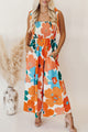 Long orange floral dress with straps tied at the smocked bust