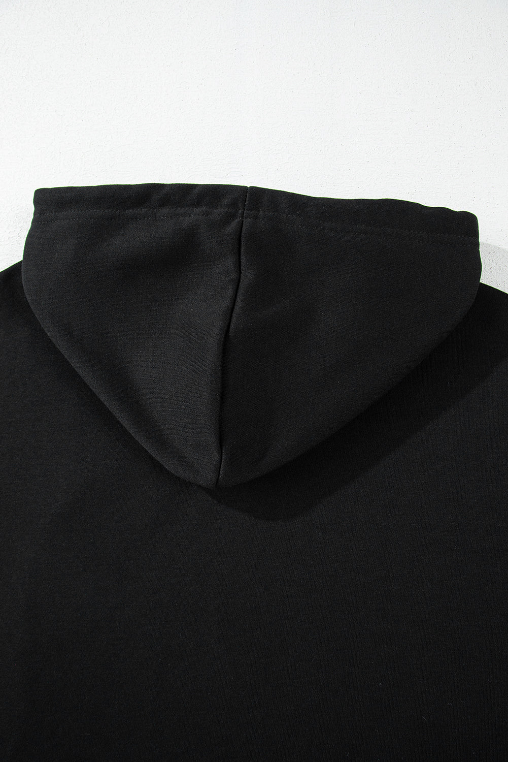 Short black hooded plain with drooping shoulders *