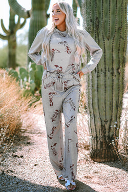 Ensemble de salon avec haut et pantalon à manches longues et bottes de cow-girl grises imprimées