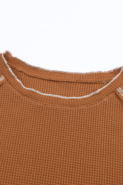 High textured brown with long sleeves and round neck *