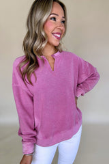 Hot pink sweatshirt with dropped shoulders and solid color notched collar