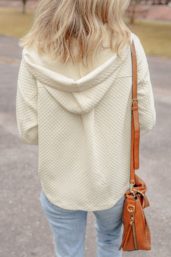 Apricot textured hoodie with button-down neckline and side pockets