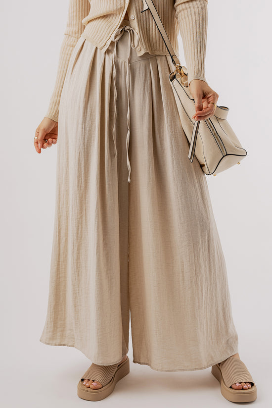 Large pleated leg relaxed pants with beige tightening cord