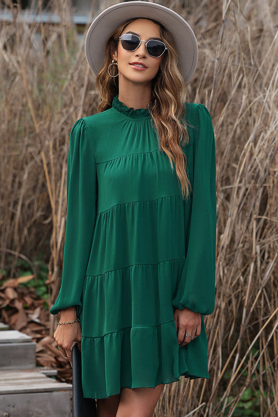 Vestido verde con volantes y mangas hinchadas *