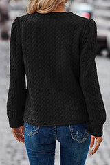 Sudadera negra texturizada con mangas hinchadas y retorcidas
