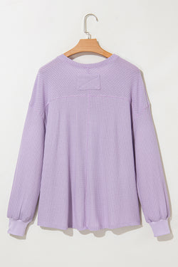 Ample blouse with embossed orchid petals, V -neck, long sleeves, falling shoulders