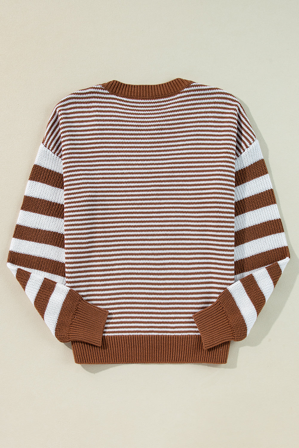 Brown sweater with textured geometric stripes and dropped shoulders