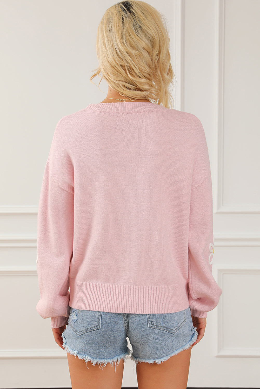 Pink chenille crew neck sweater with daisy stitching