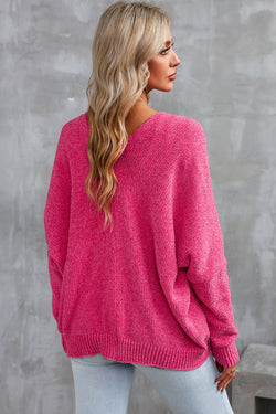 Cardigan pull avec poches sur le devant et boutons roses