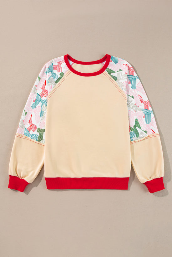 Beige patchwork print top with raglan sleeves and color block edge